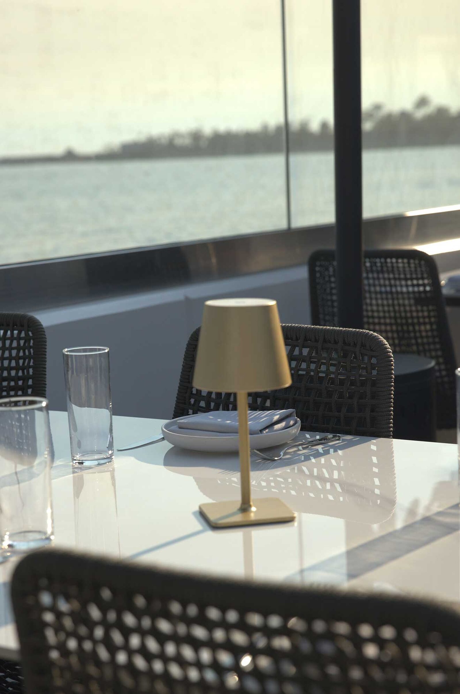 The Ellwood dining room, patio and plates by the ocean