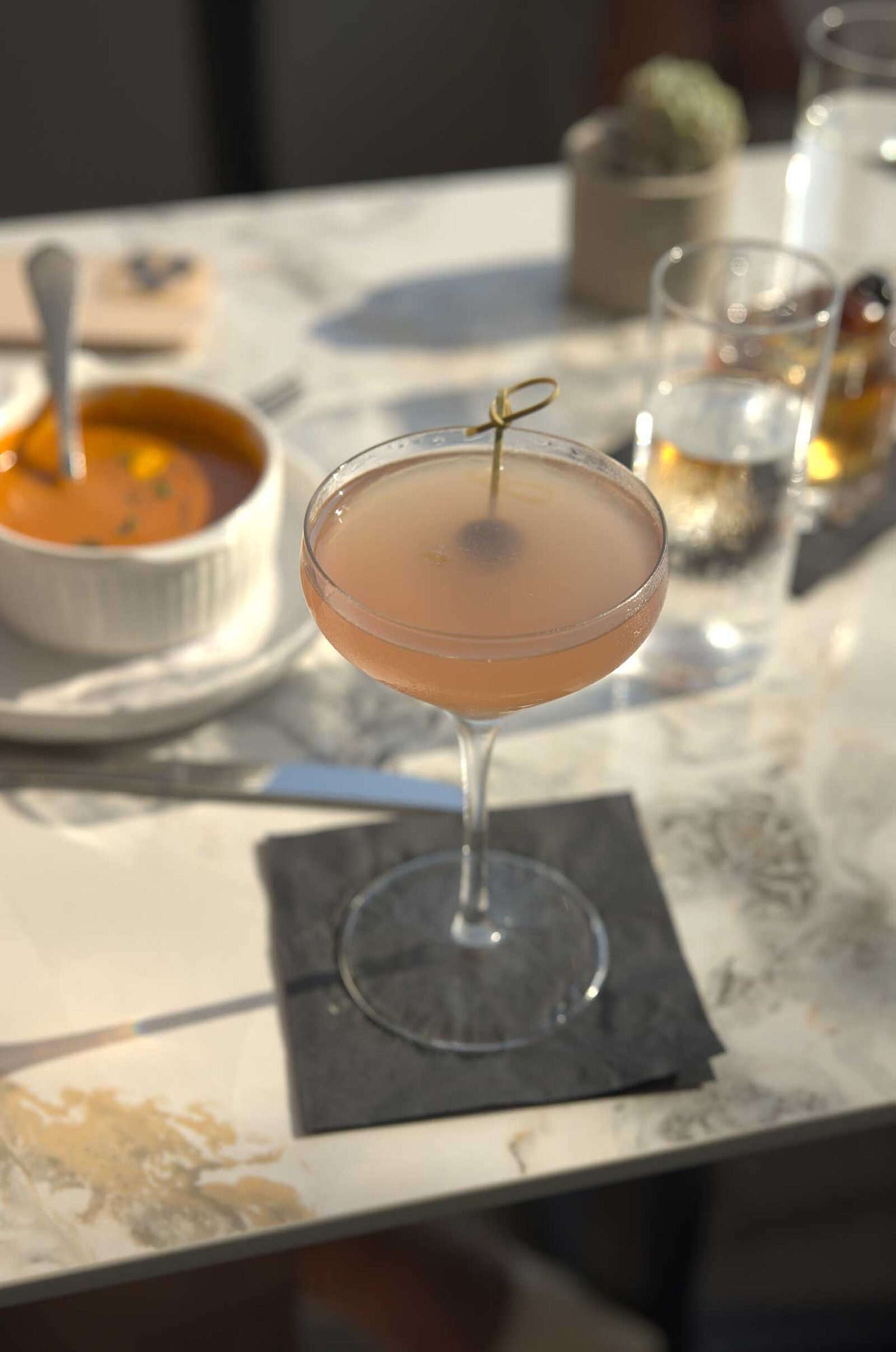 The Ellwood dining room, patio and plates by the ocean