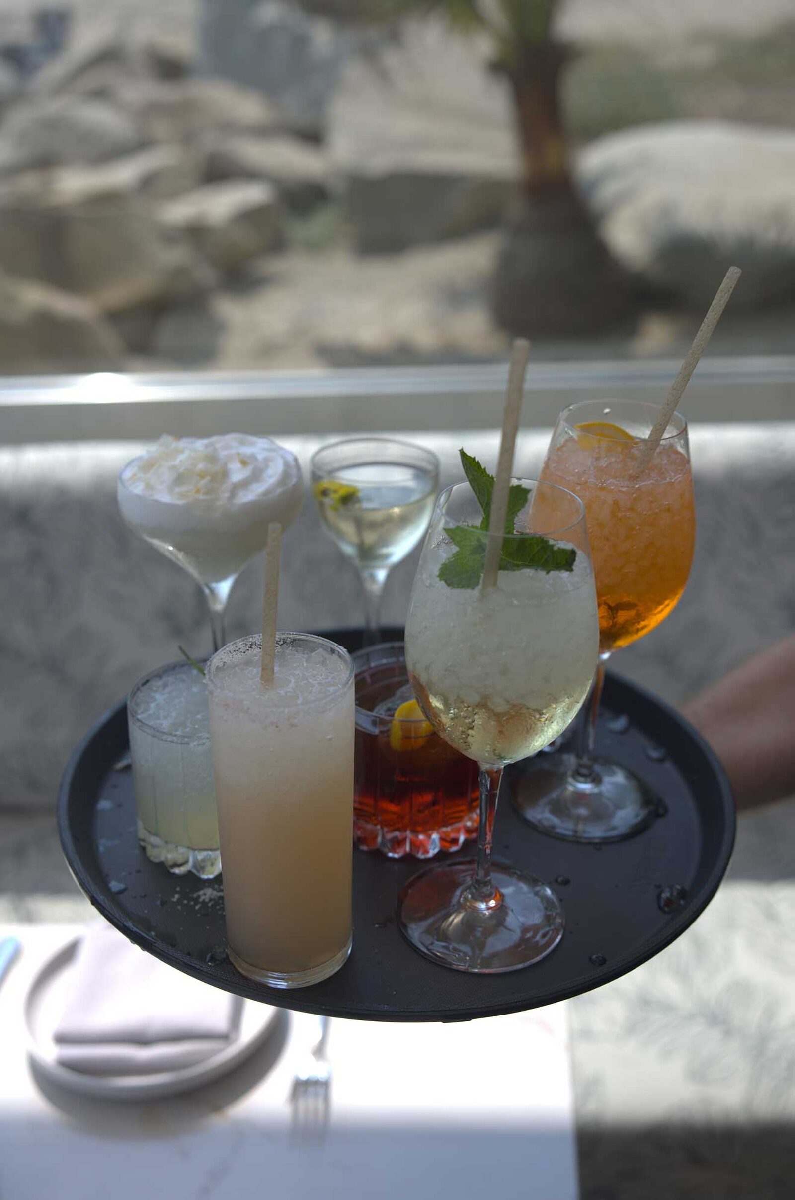 The Ellwood dining room, patio and plates by the ocean